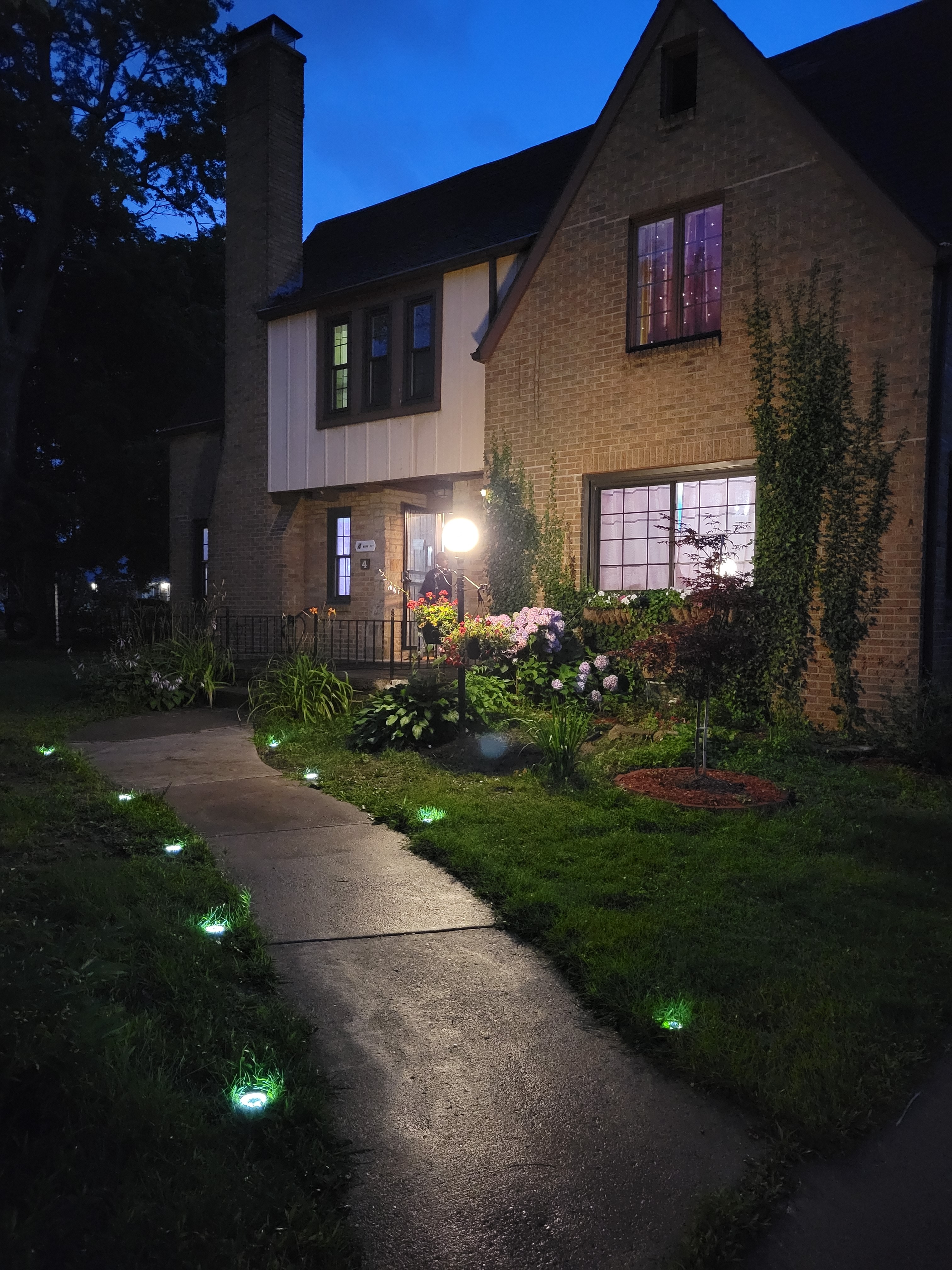 Beautiful house exterior with landscape lighting
