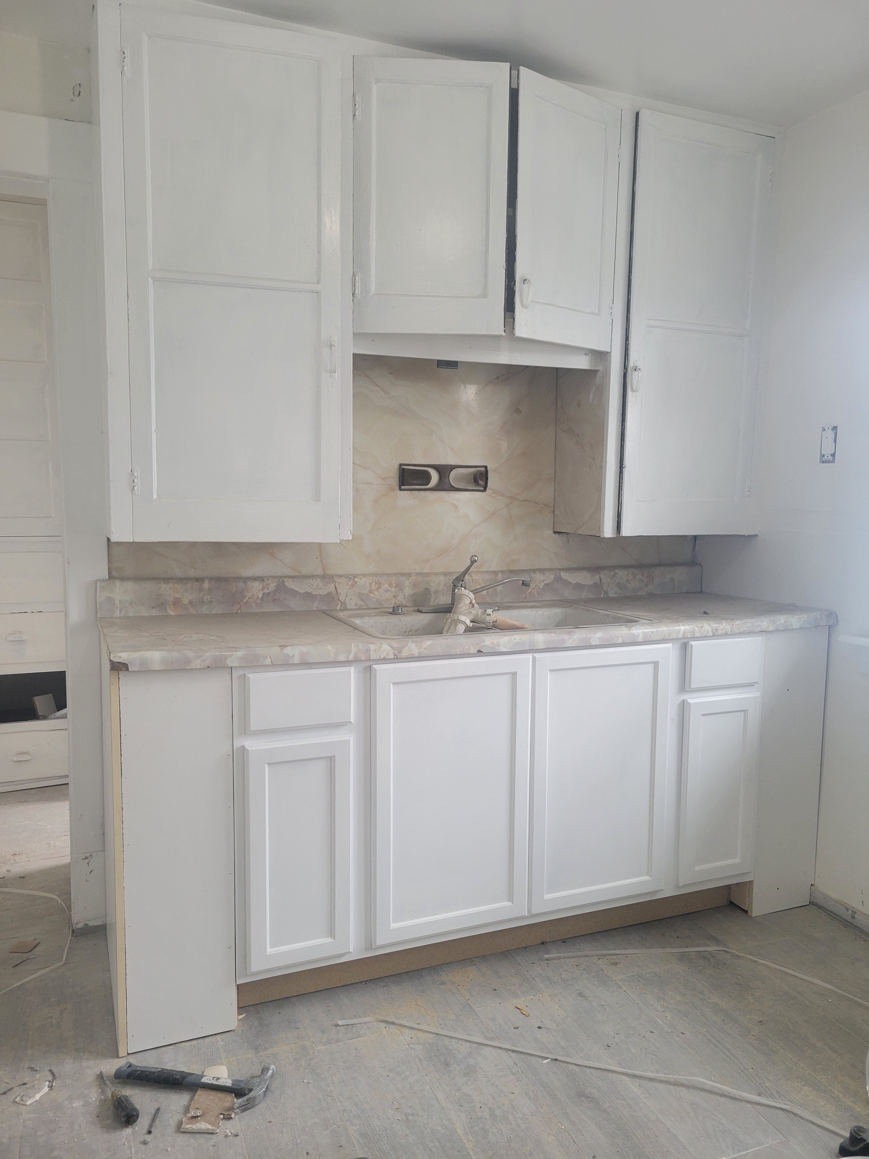 Kitchen renovation with white cabinets
